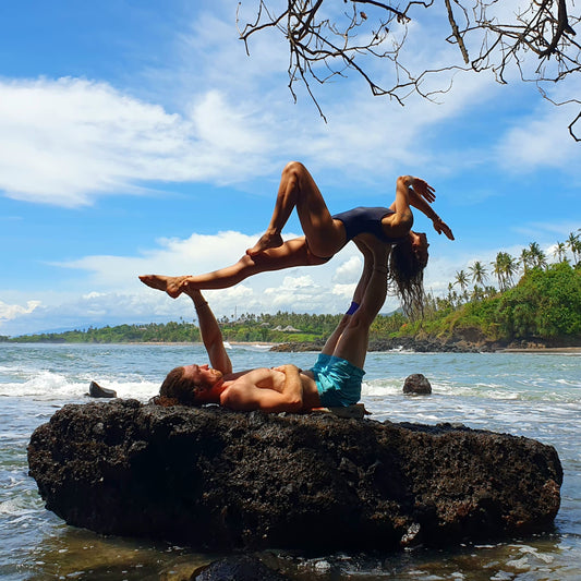 acroyoga pose high flying whale