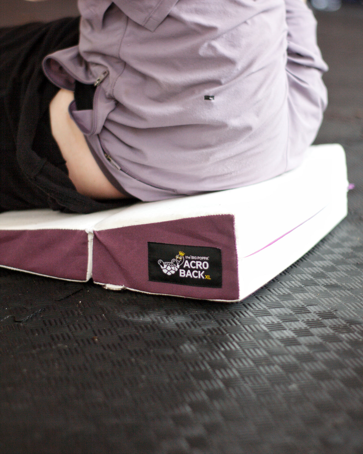 AcroBack Go supporting a seated base, showing the cushion beneath the hips