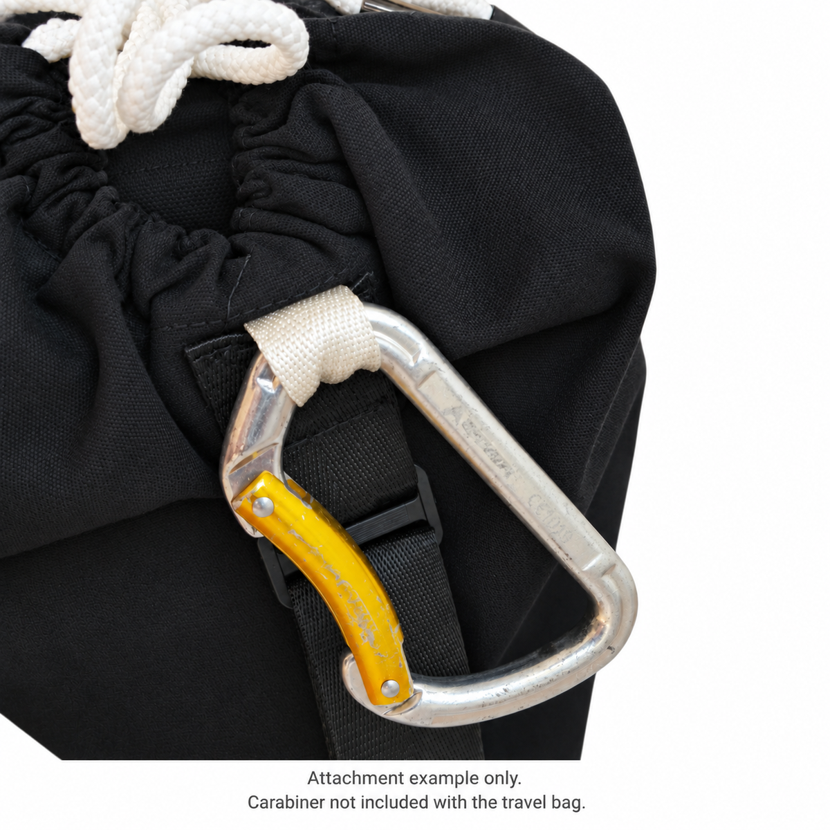 Close-up of a demonstration carabiner clipped through the AcroBack Travel Bag white attachment loop. Carabiner not included.