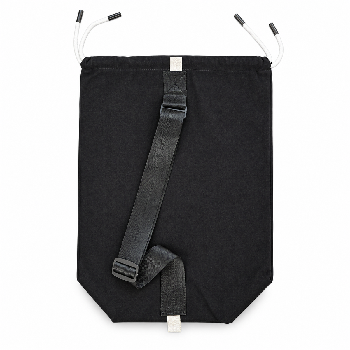 Rear view of the black AcroBack Travel Bag showing the adjustable shoulder strap and white attachment loops.