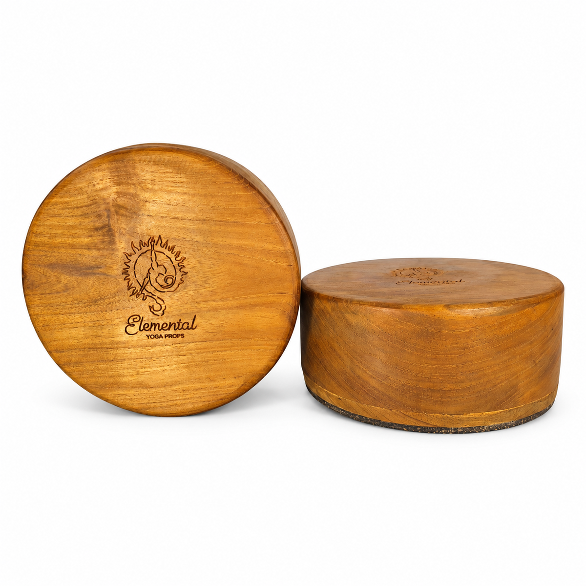 Pair of round Elemental teak handstand blocks showing the circular top and cork base on white.