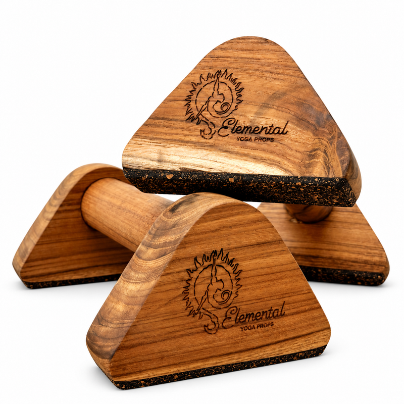 Pair of Elemental wooden parallettes stacked to show the teak handles, triangular supports and cork bases on white.